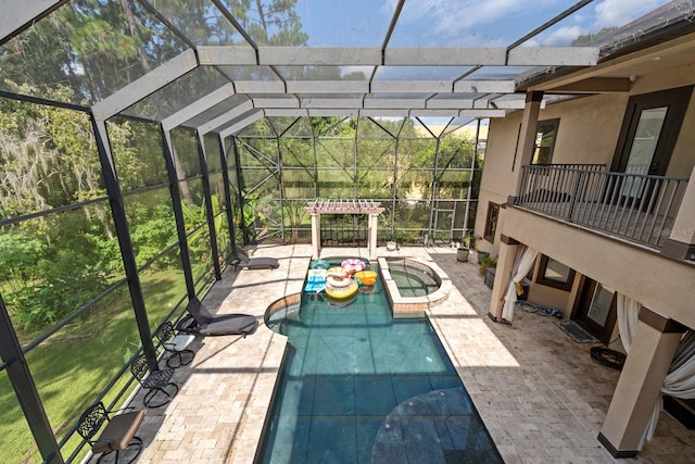 view of swimming pool with a lanai and a patio area