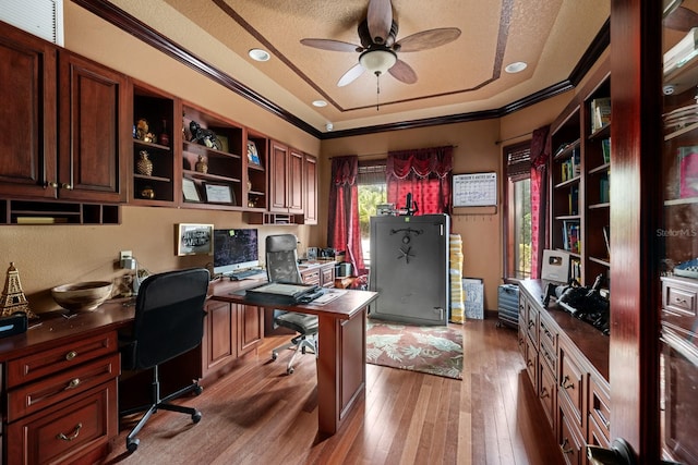 office with a textured ceiling, crown molding, light hardwood / wood-style floors, and ceiling fan