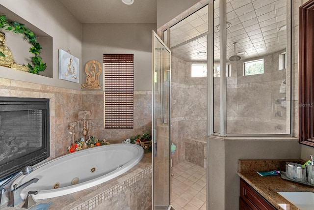 bathroom featuring vanity and plus walk in shower