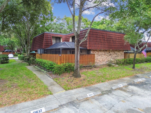 view of property exterior featuring a yard