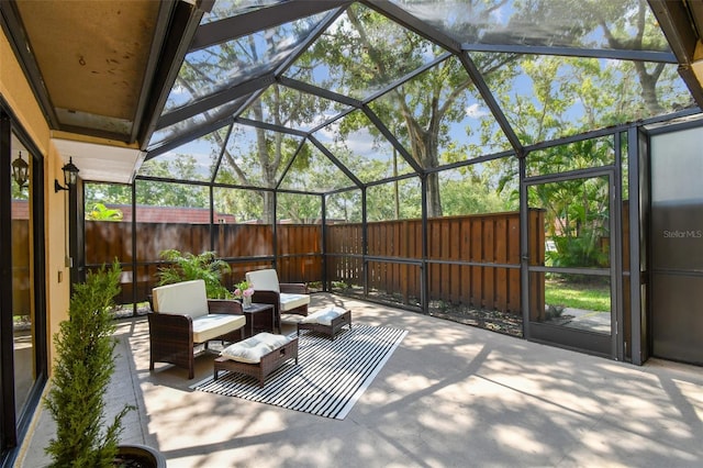 view of patio featuring a lanai