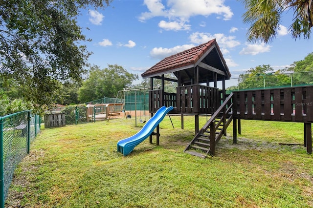 view of jungle gym with a lawn