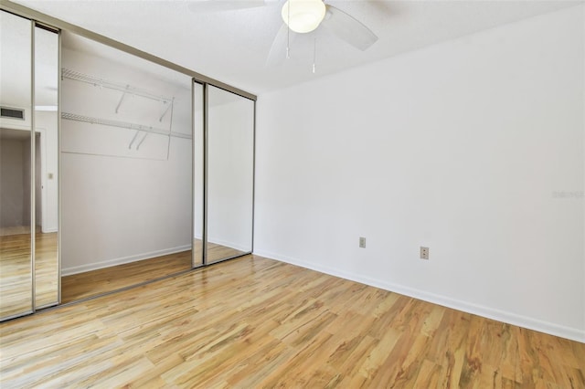 unfurnished bedroom featuring ceiling fan and light hardwood / wood-style floors