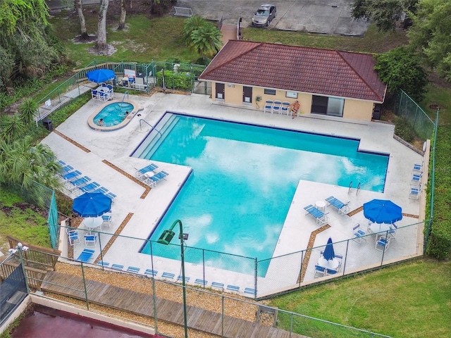 view of pool featuring a patio