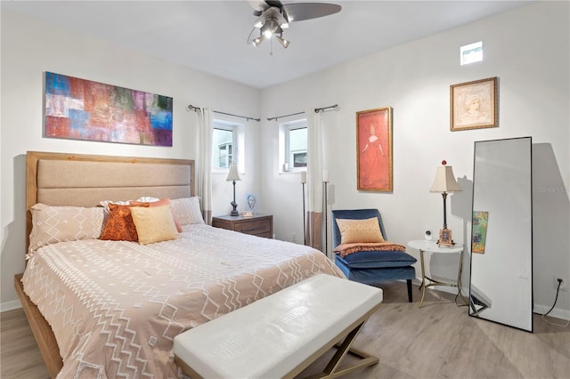 bedroom featuring light hardwood / wood-style floors and ceiling fan