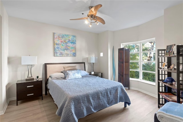 bedroom featuring ceiling fan and light hardwood / wood-style floors