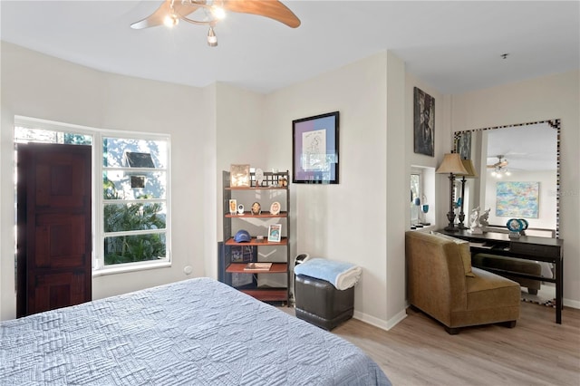 bedroom featuring ceiling fan and light hardwood / wood-style floors