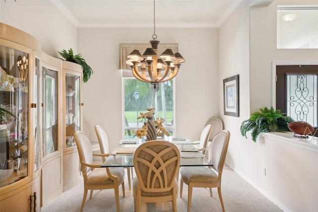 carpeted dining space featuring crown molding and a notable chandelier