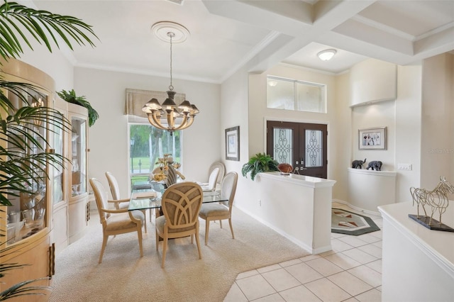 tiled dining space featuring beam ceiling, a chandelier, crown molding, french doors, and coffered ceiling