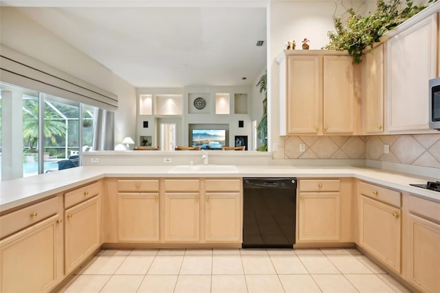 kitchen with black dishwasher, kitchen peninsula, backsplash, sink, and light tile patterned flooring