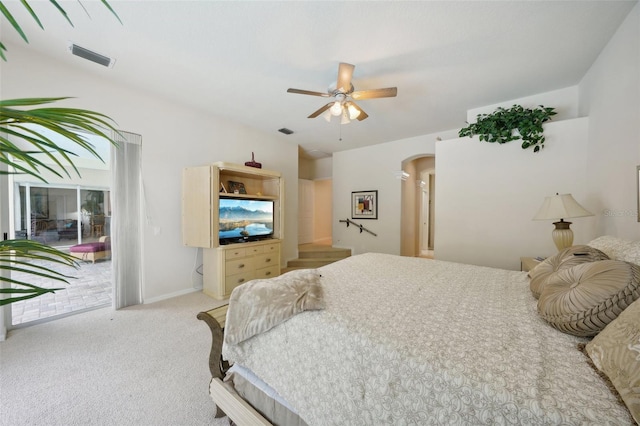 carpeted bedroom featuring ceiling fan and access to exterior