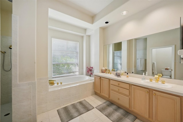 full bathroom featuring vanity, toilet, separate shower and tub, and tile patterned flooring