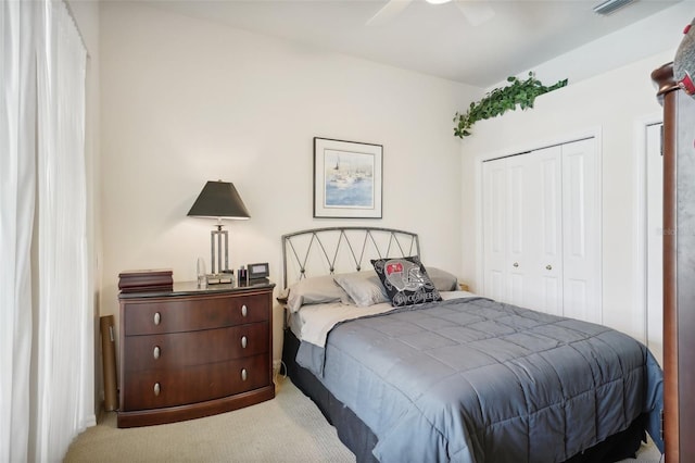 bedroom featuring carpet floors, a closet, and ceiling fan