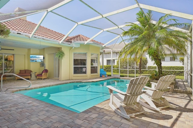 view of pool featuring a patio area and a lanai