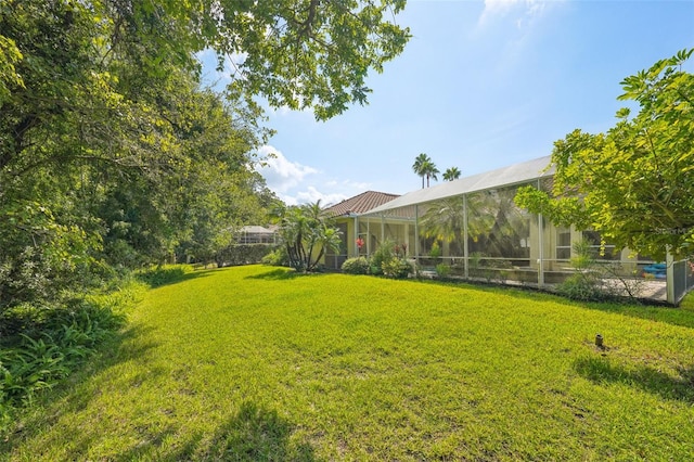 view of yard with a lanai