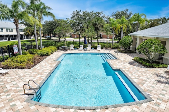 view of pool featuring a patio