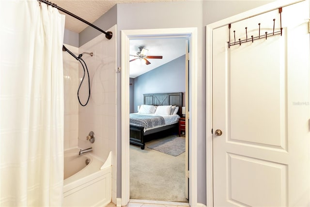 bathroom with shower / tub combo with curtain, lofted ceiling, ceiling fan, and a textured ceiling