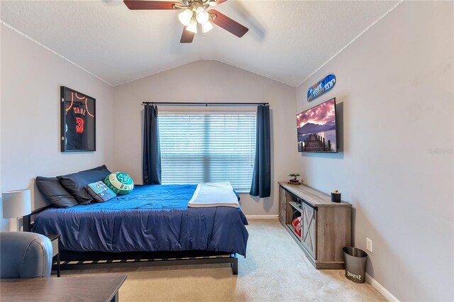 bedroom with ceiling fan, light colored carpet, and lofted ceiling