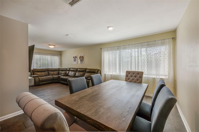 dining area featuring baseboards and visible vents