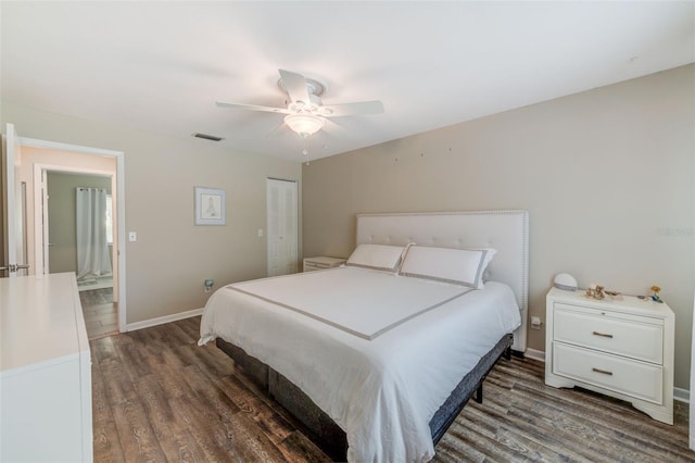 bedroom with baseboards, visible vents, ceiling fan, and wood finished floors