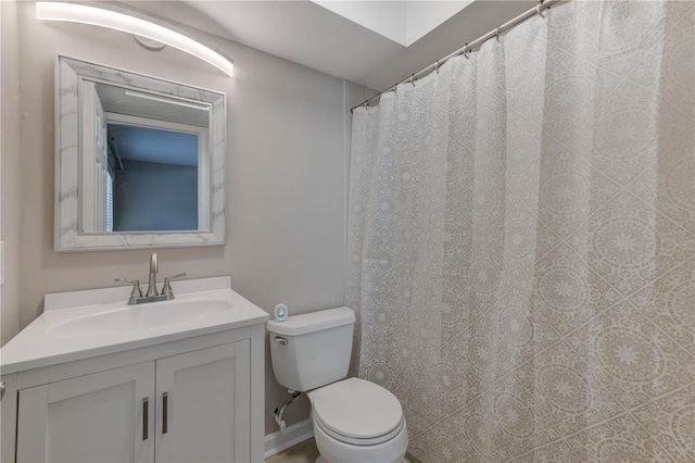 full bathroom with toilet and vanity