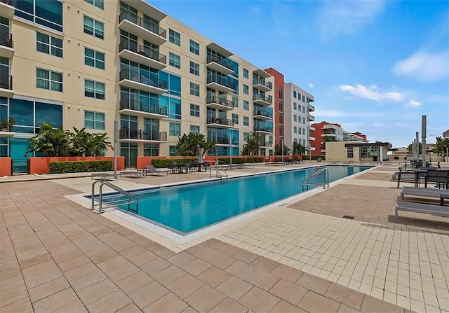 view of swimming pool with a patio