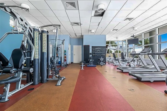 workout area with a paneled ceiling