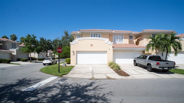 mediterranean / spanish house featuring a garage