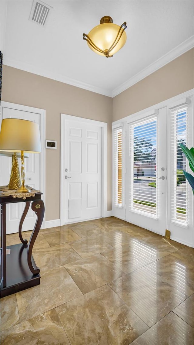 entrance foyer with crown molding