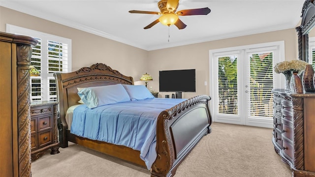 bedroom with multiple windows, light colored carpet, and ceiling fan