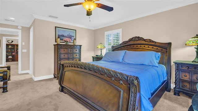 bedroom with ornamental molding, ceiling fan, and light colored carpet