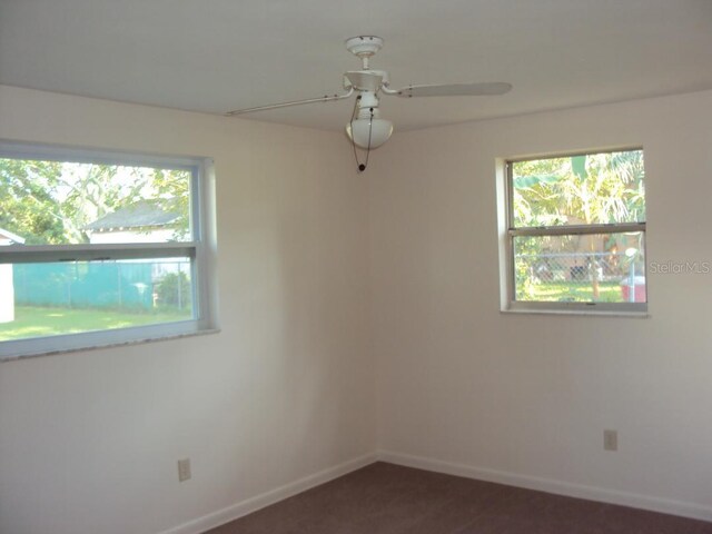 spare room with ceiling fan