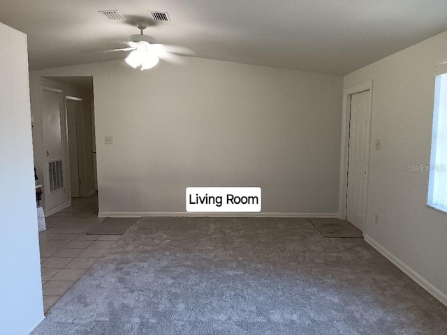 unfurnished room with light colored carpet and ceiling fan