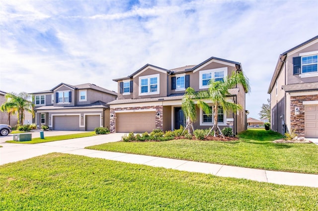 view of front of property with a garage and a front lawn