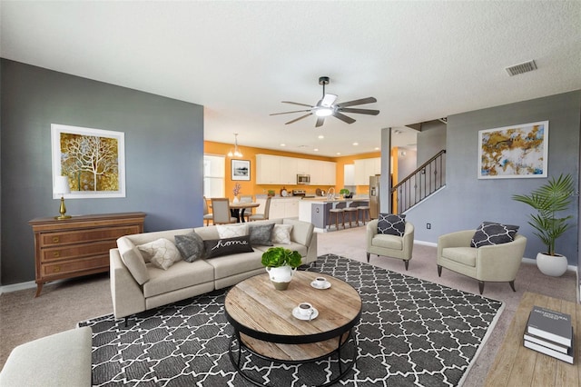 living room featuring ceiling fan