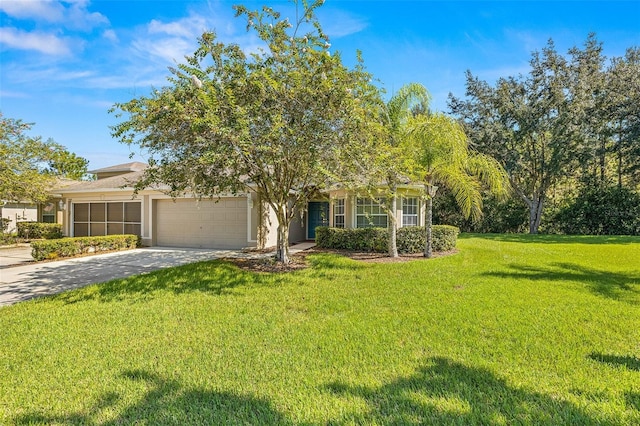 view of property hidden behind natural elements featuring a garage and a front lawn