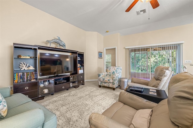 carpeted living room with ceiling fan