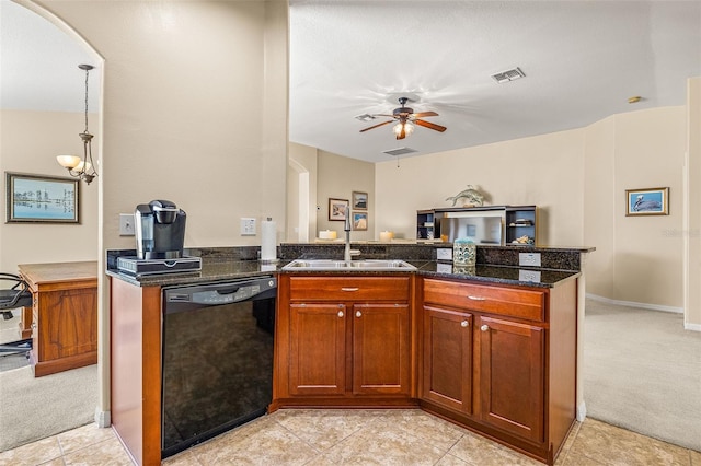 kitchen featuring ceiling fan, light colored carpet, dishwasher, and dark stone counters