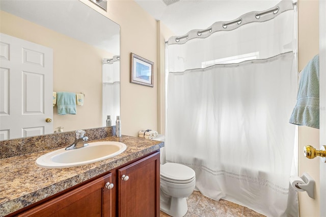 full bathroom featuring tile patterned floors, shower / bath combo, vanity, and toilet