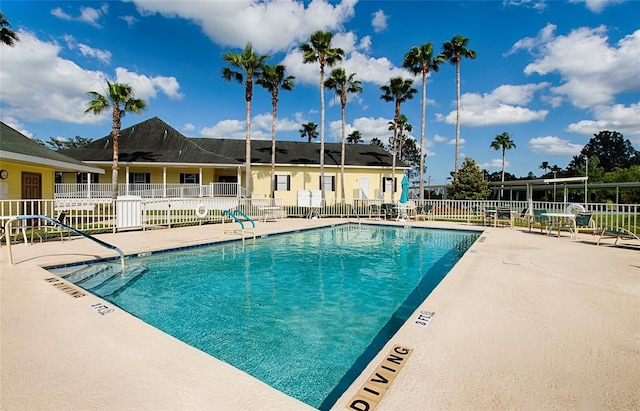 view of swimming pool with a patio area