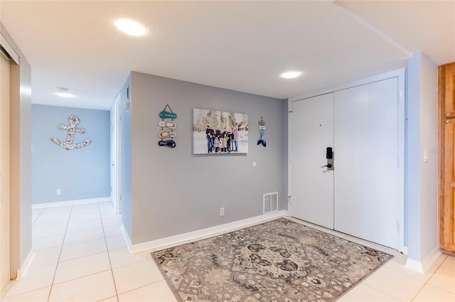 foyer featuring light tile patterned floors