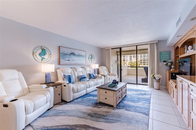 tiled living room with a textured ceiling