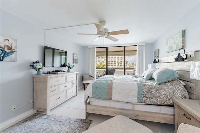 bedroom with ceiling fan, light tile patterned flooring, and access to outside