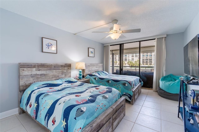 bedroom featuring light tile patterned floors, ceiling fan, and access to exterior