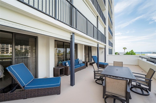 view of patio / terrace with a balcony and an outdoor living space