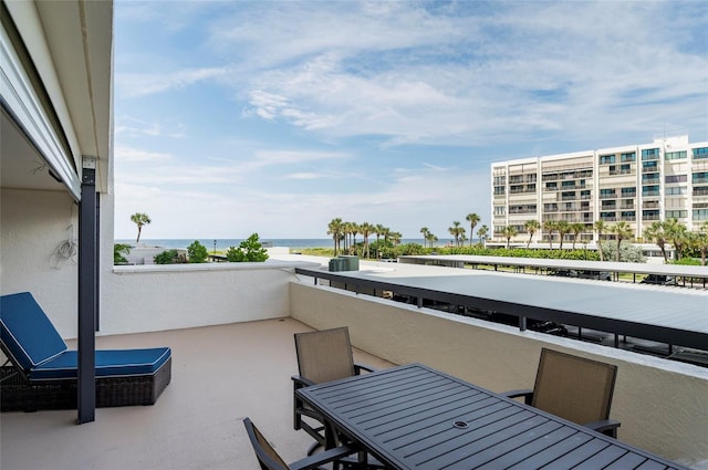 balcony featuring a water view