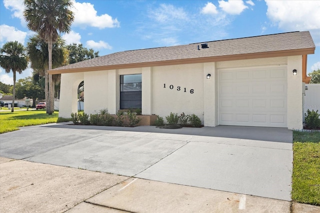 single story home with a garage