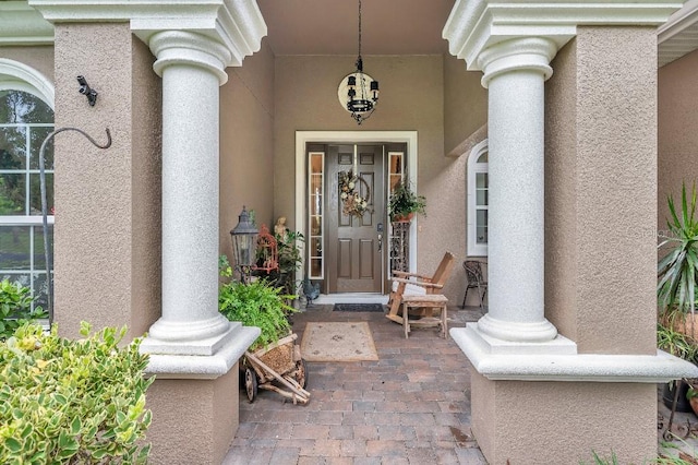 property entrance with covered porch