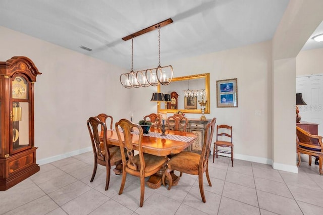 dining space featuring light tile patterned floors