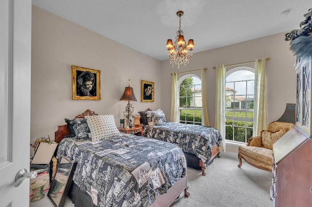 bedroom featuring light carpet and a notable chandelier